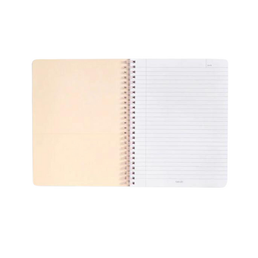 Cuaderno espiral "Face The Day" con 160 páginas rayadas, bolsillos dobles, espiral metálico de colores y frase inspiradora en la portada.