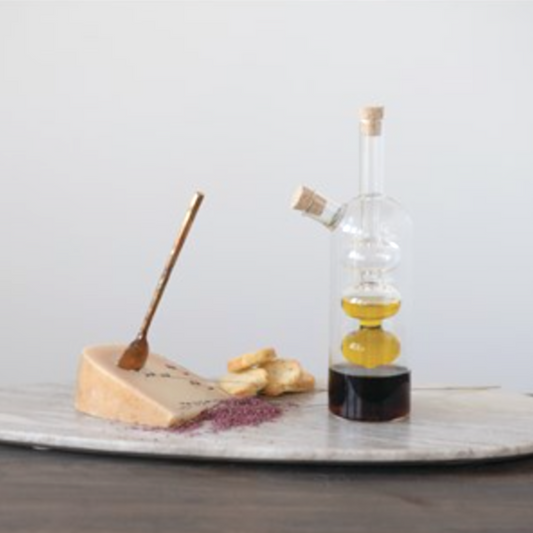 Recipiente para aceite y vinagre de vidrio soplado con tapas de corcho, diseño moderno y elegante, ideal para cualquier estilo de cocina.