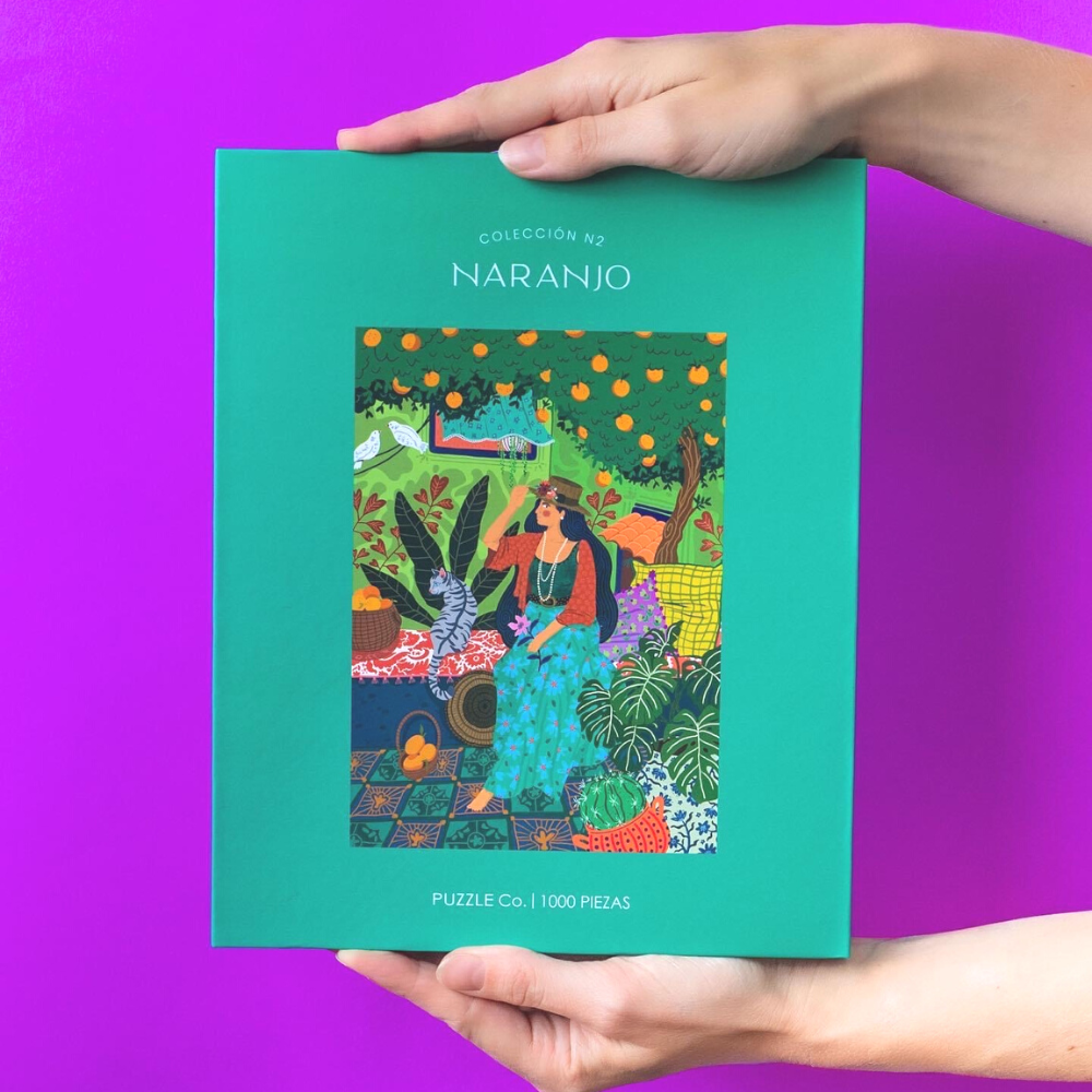 Rompecabezas de 1000 piezas "Naranjo" de Puzzle Co., con ilustración vibrante de un naranjo, ideal para relajación y momentos en familia.