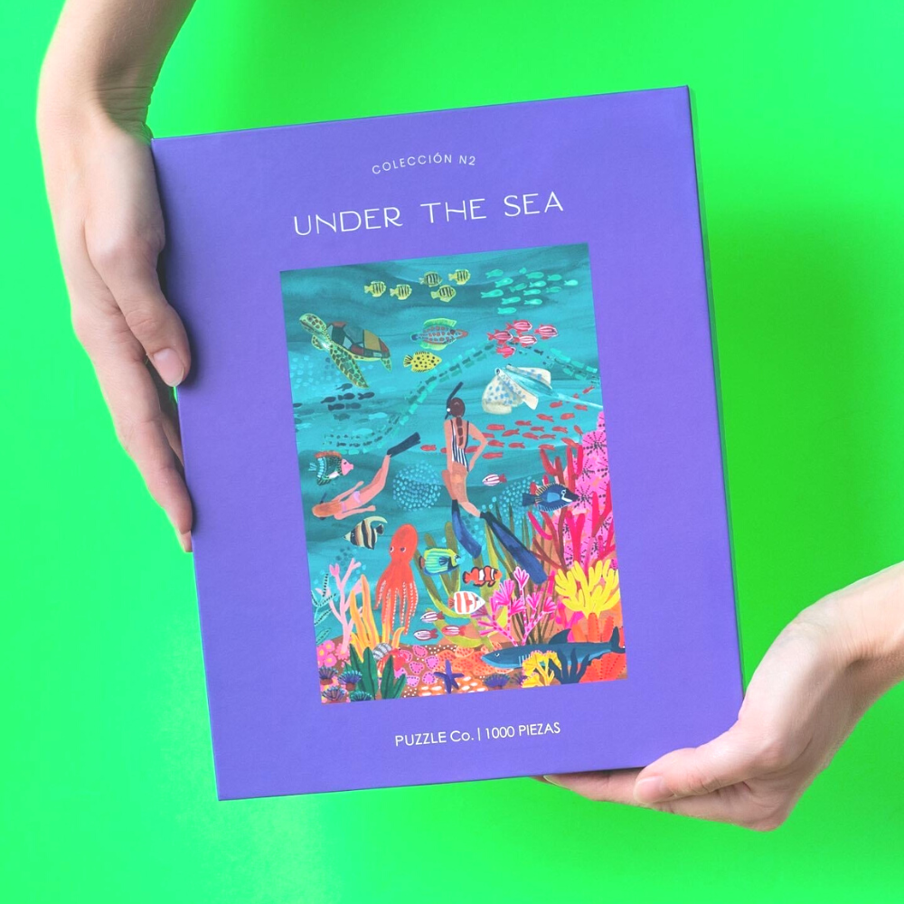 Rompecabezas de 1000 piezas "Under the Sea" de Puzzle Co., con ilustraciones marinas llenas de color, ideal para momentos de relajación y diversión en casa.