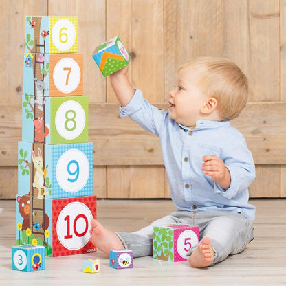 Cubos apilables del bosque para bebés desde 12 meses, marca Goula. Incluye 10 cubos con ilustraciones de animales y escenarios, ideal para estimular motricidad y creatividad.