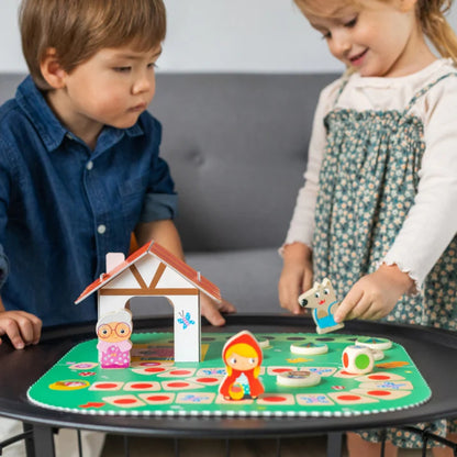 Juego cooperativo Caperucita Roja de Goula para niños desde 2 años. Incluye tablero tipo rompecabezas, figuras del cuento, casa 3D y accesorios, ideal para jugar en familia y aprender en equipo.