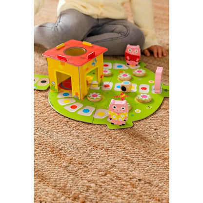 Juego de mesa Los Tres Cerditos de Goula para niños desde 2 años. Incluye personajes, casa 3D, tablero y accesorios del cuento, ideal para desarrollar habilidades cognitivas y sociales jugando en familia.