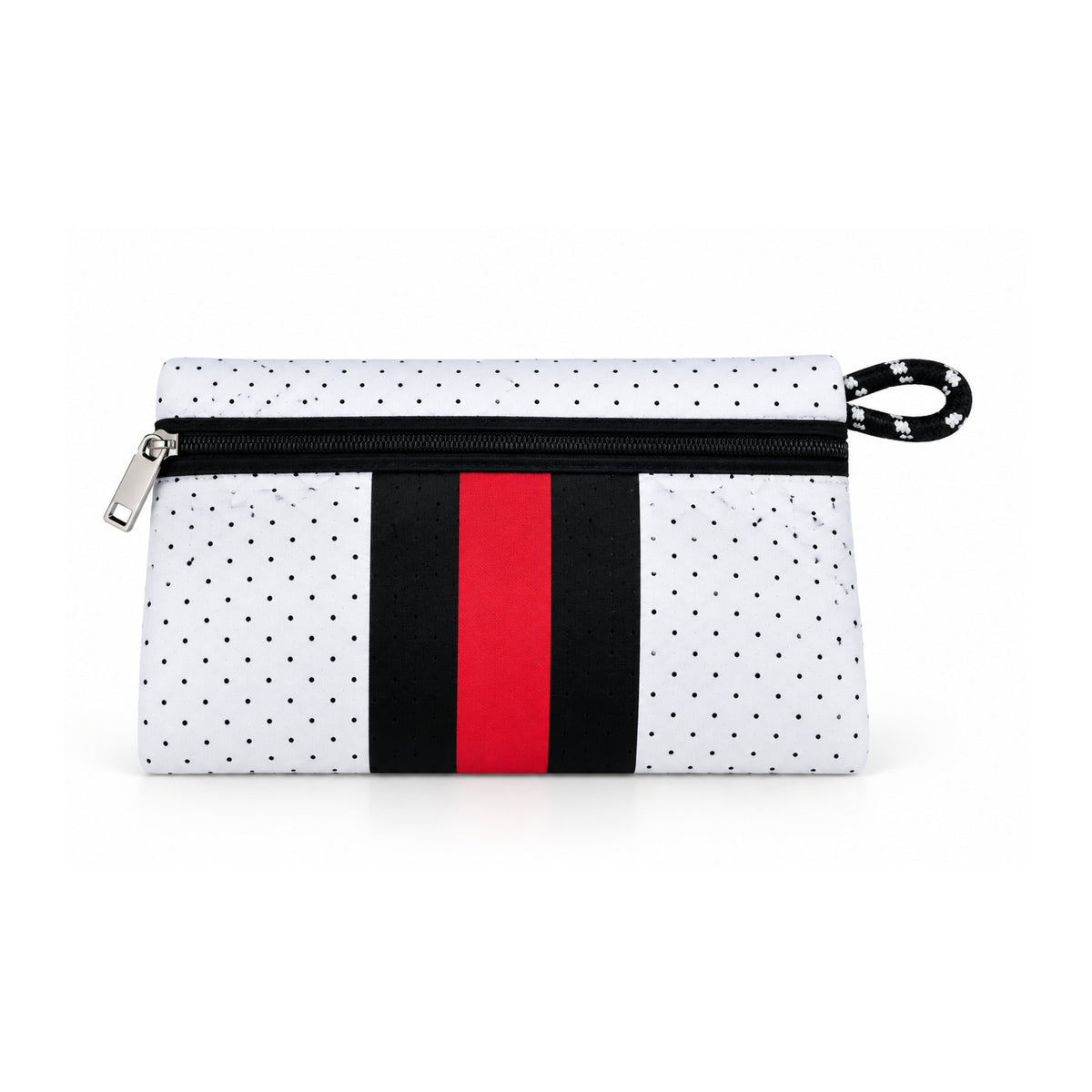 Neceser de neopreno blanco con puntos negros y franja central roja, abierto y con productos de cuidado personal.