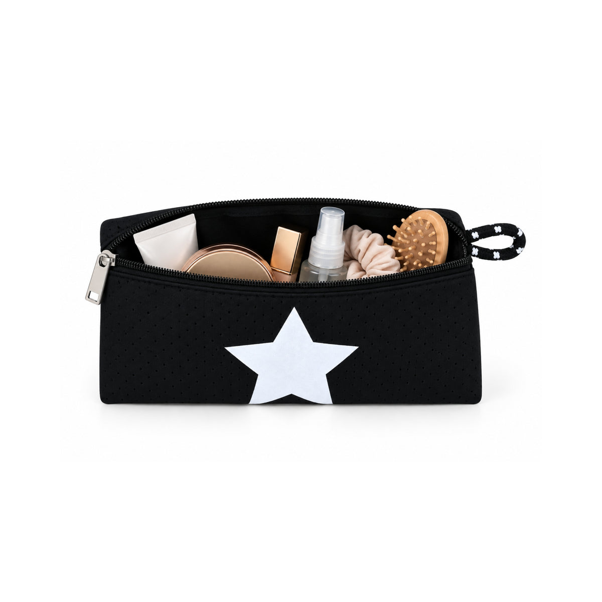 Neceser de neopreno negro con estrella blanca, abierto y con productos de cuidado personal.