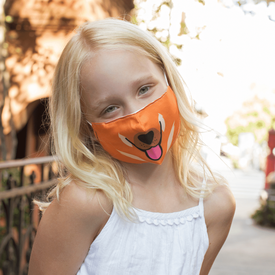 Mascarilla para niños de doble capa con tiras regulables, disponible en 4 diseños: gato, perro, tigre y oso. Ideal para protección y comodidad.